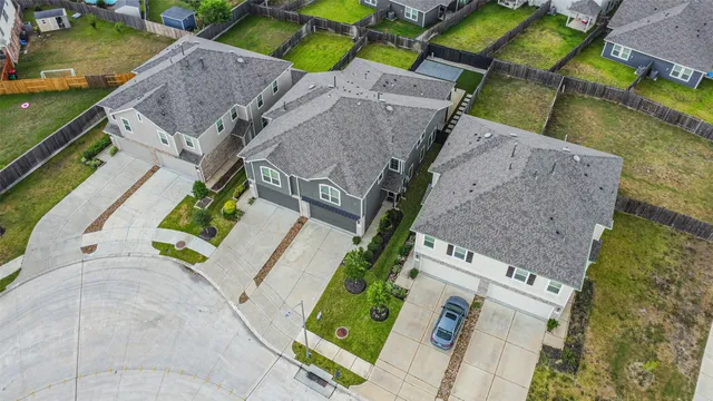 an aerial view of residential houses with outdoor space