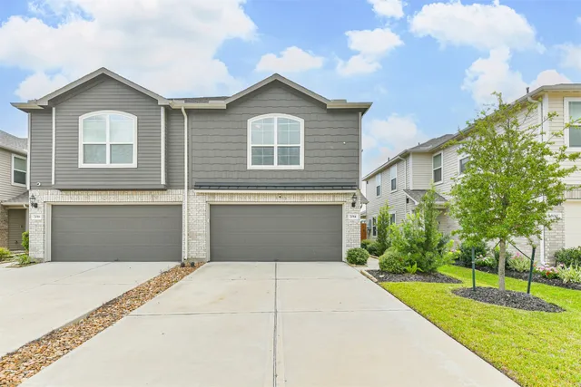 a front view of a house with yard