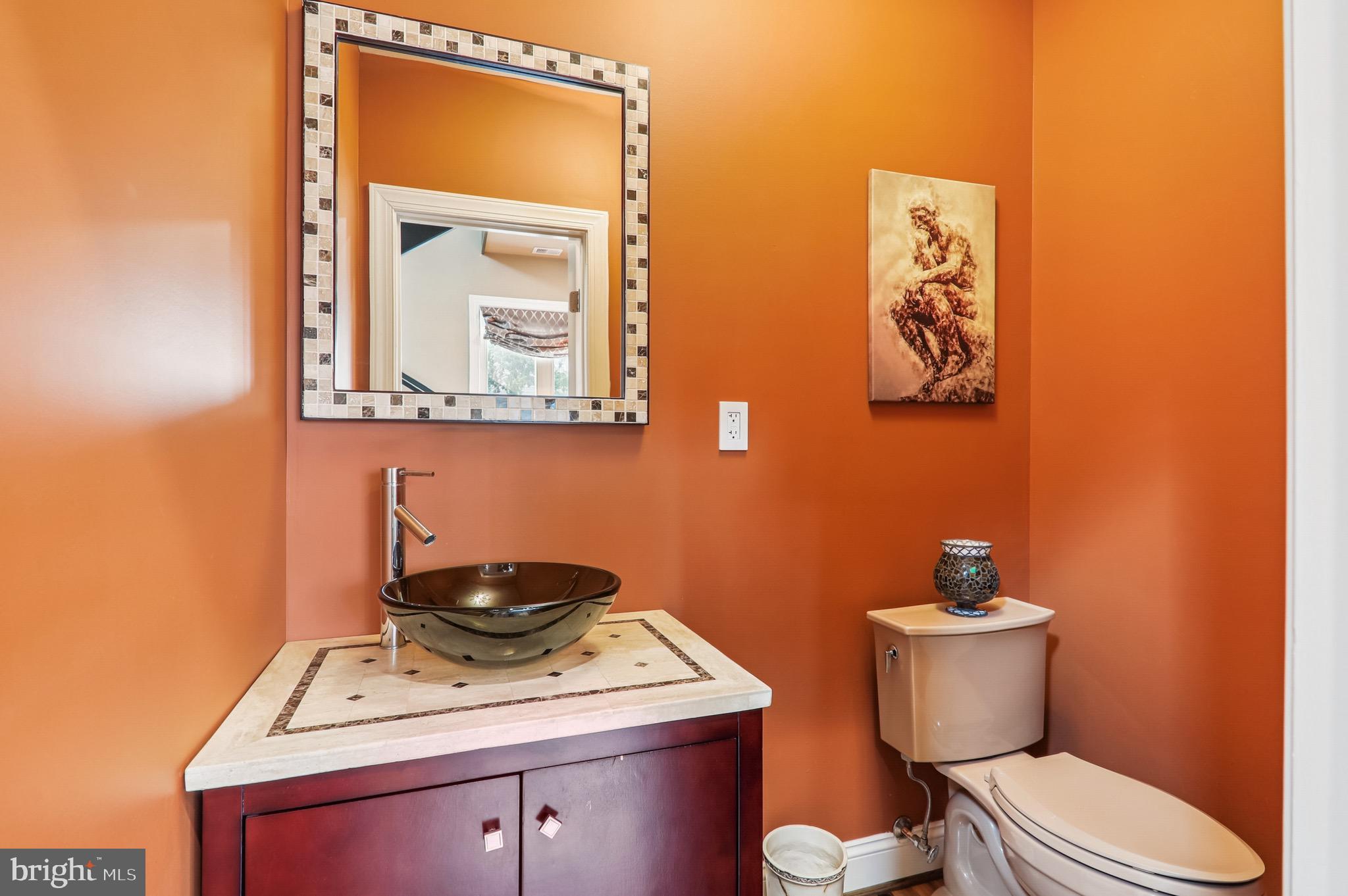 4200 19th Street Northeast Washington, DC 20018 - Photo 13 of 34 a bathroom with a toilet a sink and mirror