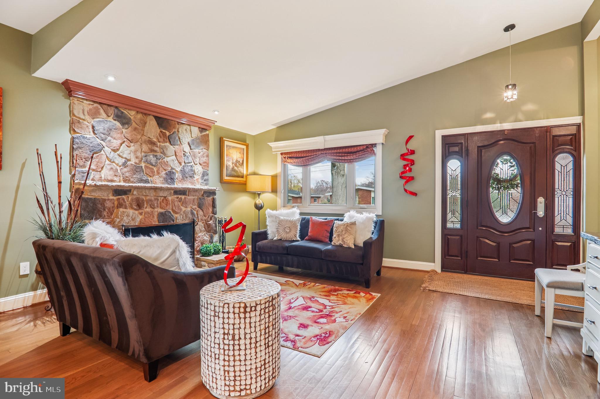 4200 19th Street Northeast Washington, DC 20018 - Photo 2 of 34 a living room with furniture a rug and a painting on the wall