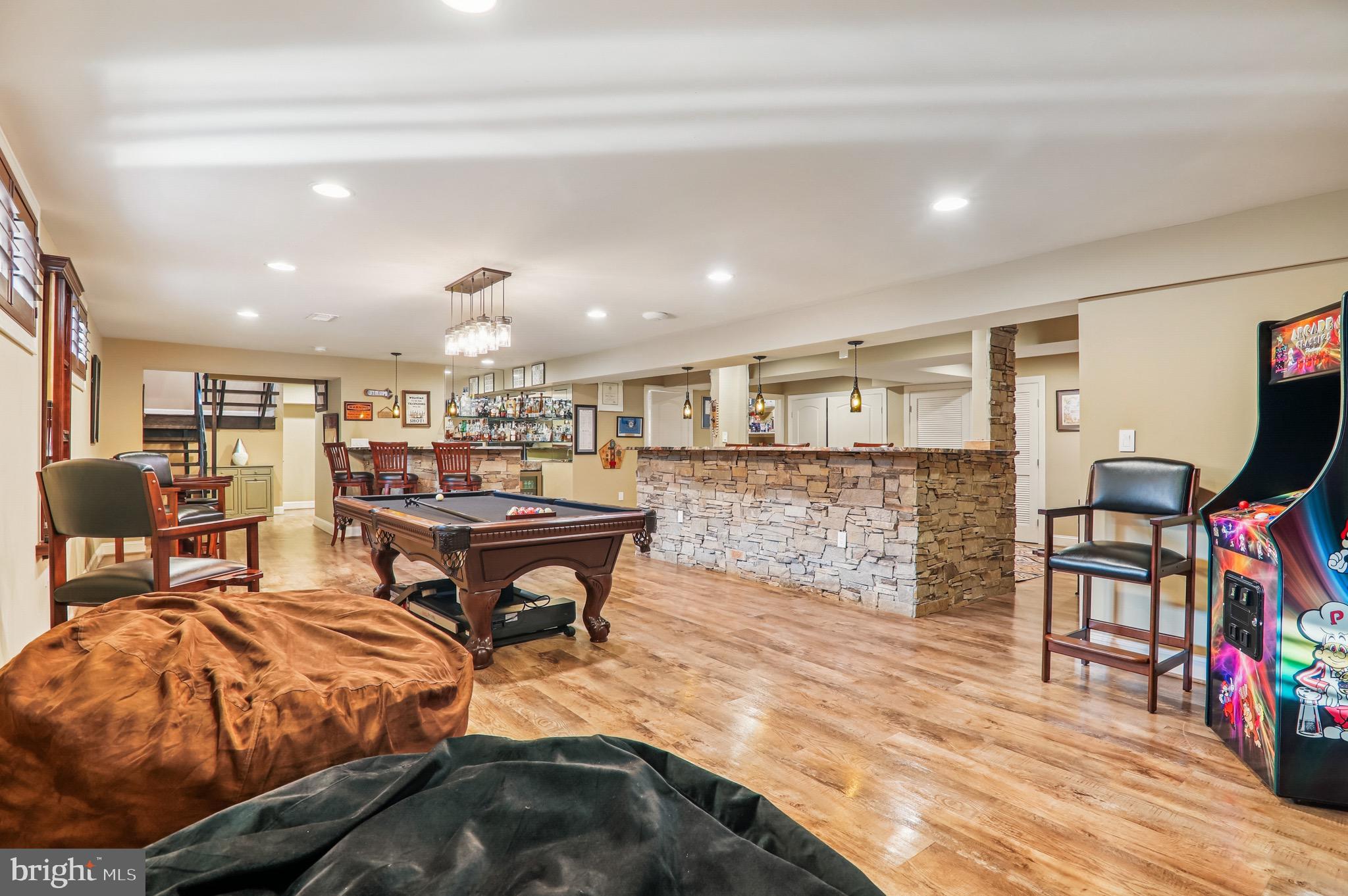 4200 19th Street Northeast Washington, DC 20018 - Photo 28 of 34 a living room with furniture a flat screen tv and a table
