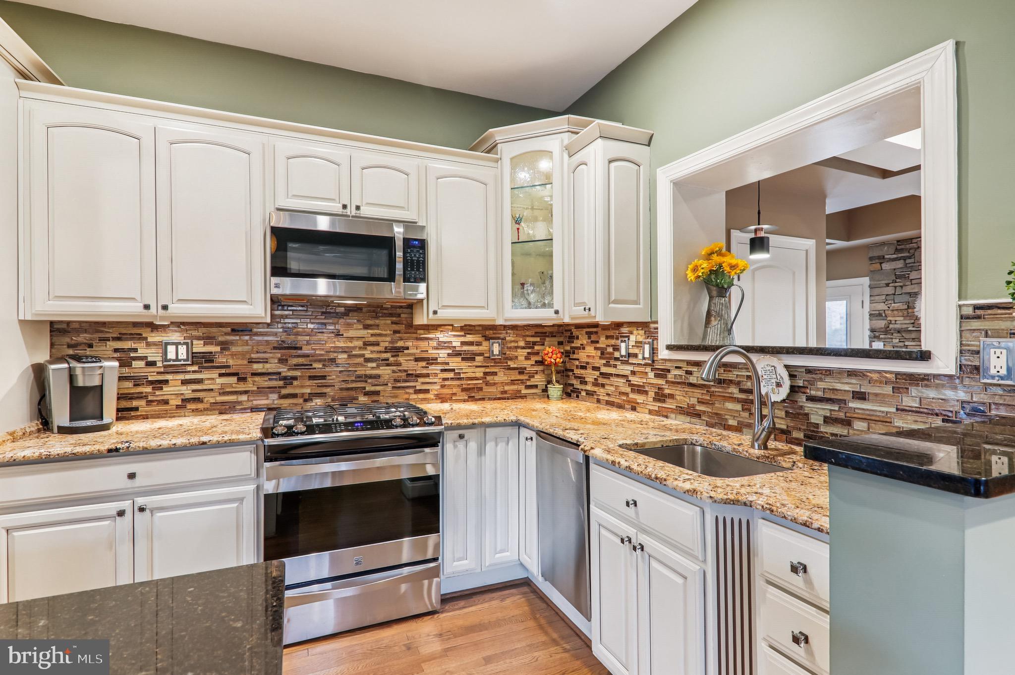 4200 19th Street Northeast Washington, DC 20018 - Photo 7 of 34 a kitchen with a sink stove and microwave