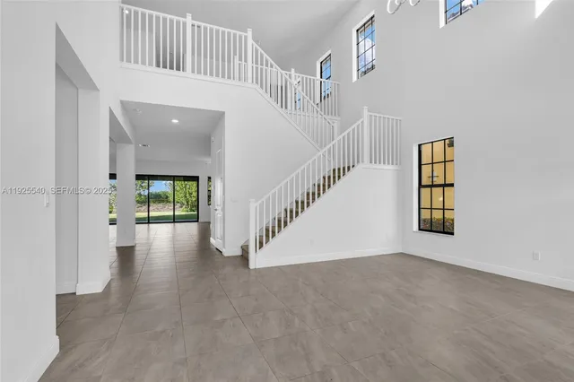 a view of an entryway with a front door