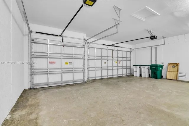 an aerial view of residential houses with outdoor space and swimming pool