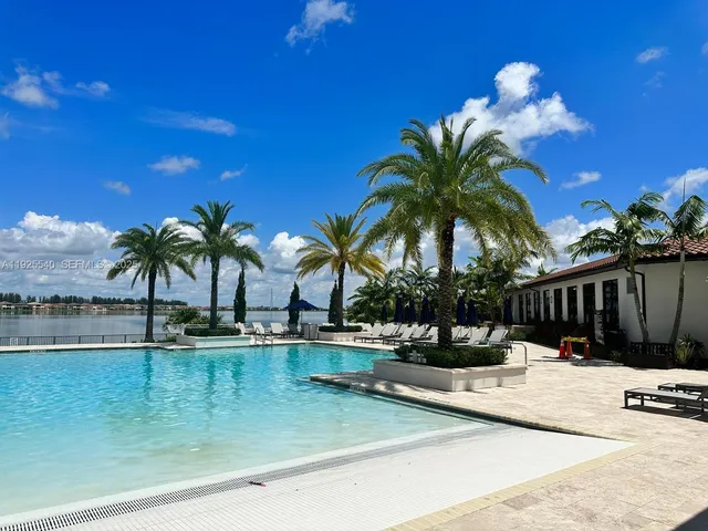a view of a patio with furniture and a yard