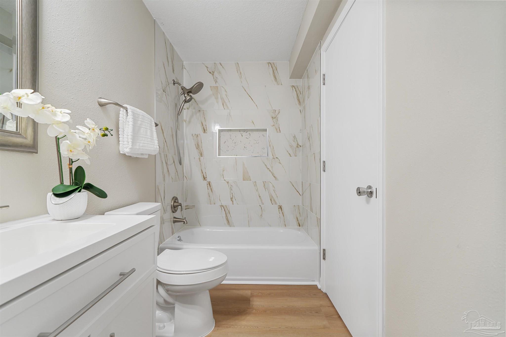 284 Dolan Drive Cantonment, FL 32533 - Photo 8 of 32 a bathroom with a sink a toilet and shower