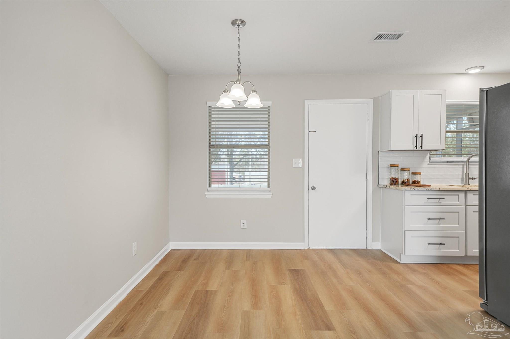 284 Dolan Drive Cantonment, FL 32533 - Photo 10 of 32 a view of a kitchen with dishwasher and a cabinet