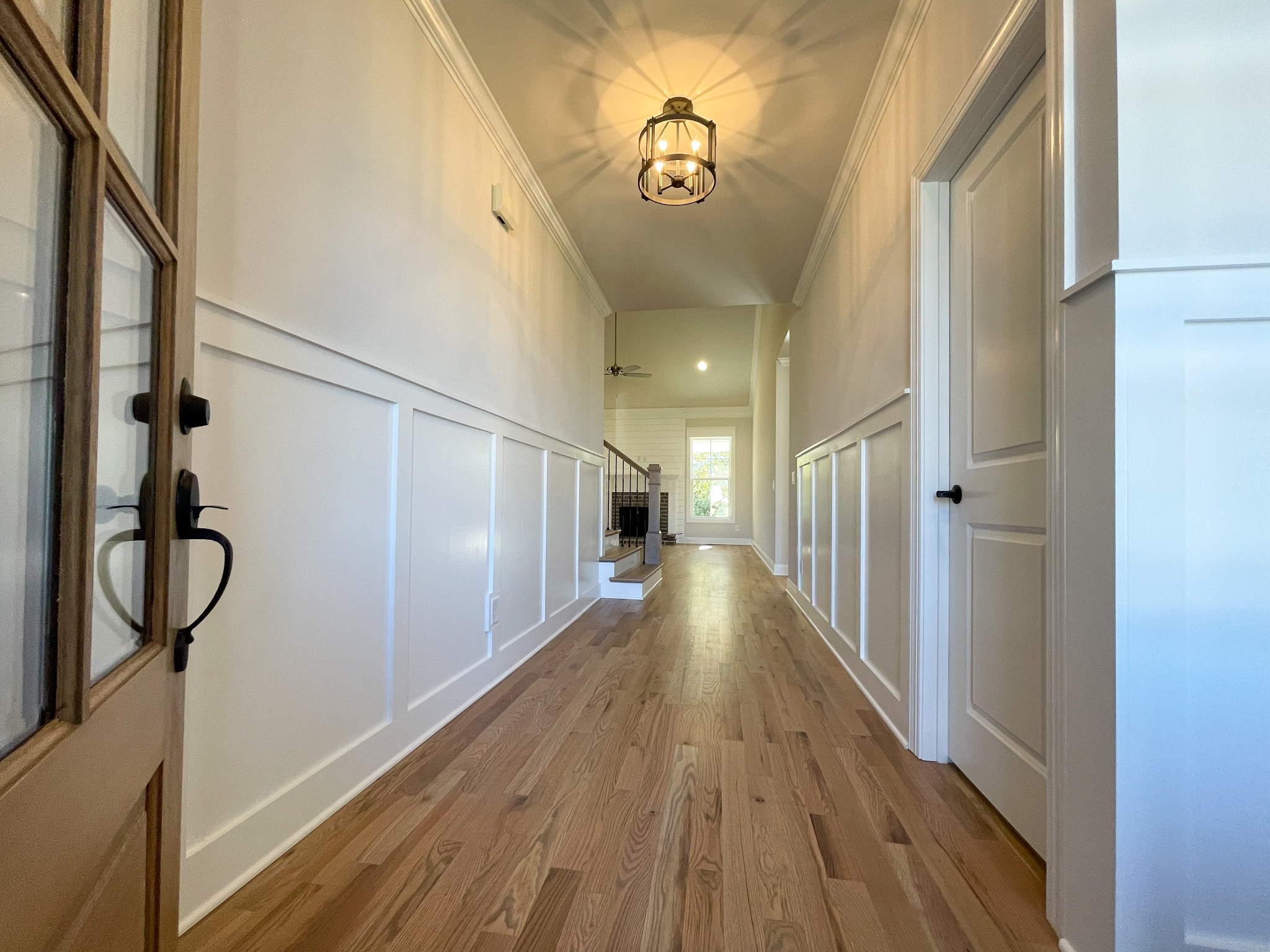 3035 Turnstone Trace Spring Hill, TN 37174 - Photo 2 of 41 a view of a hallway with wooden floor