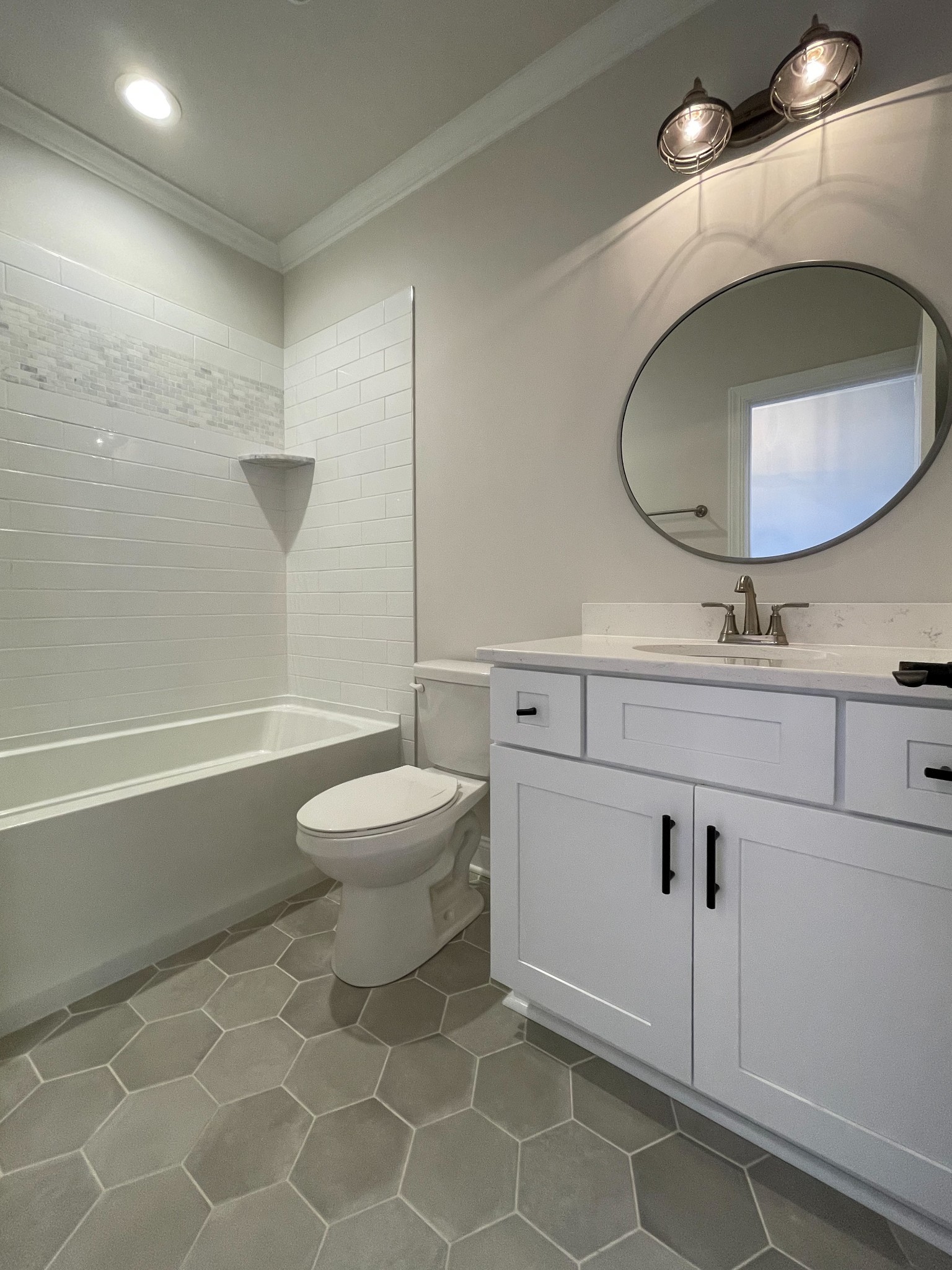 3035 Turnstone Trace Spring Hill, TN 37174 - Photo 24 of 41 a bathroom with a toilet a sink and mirror