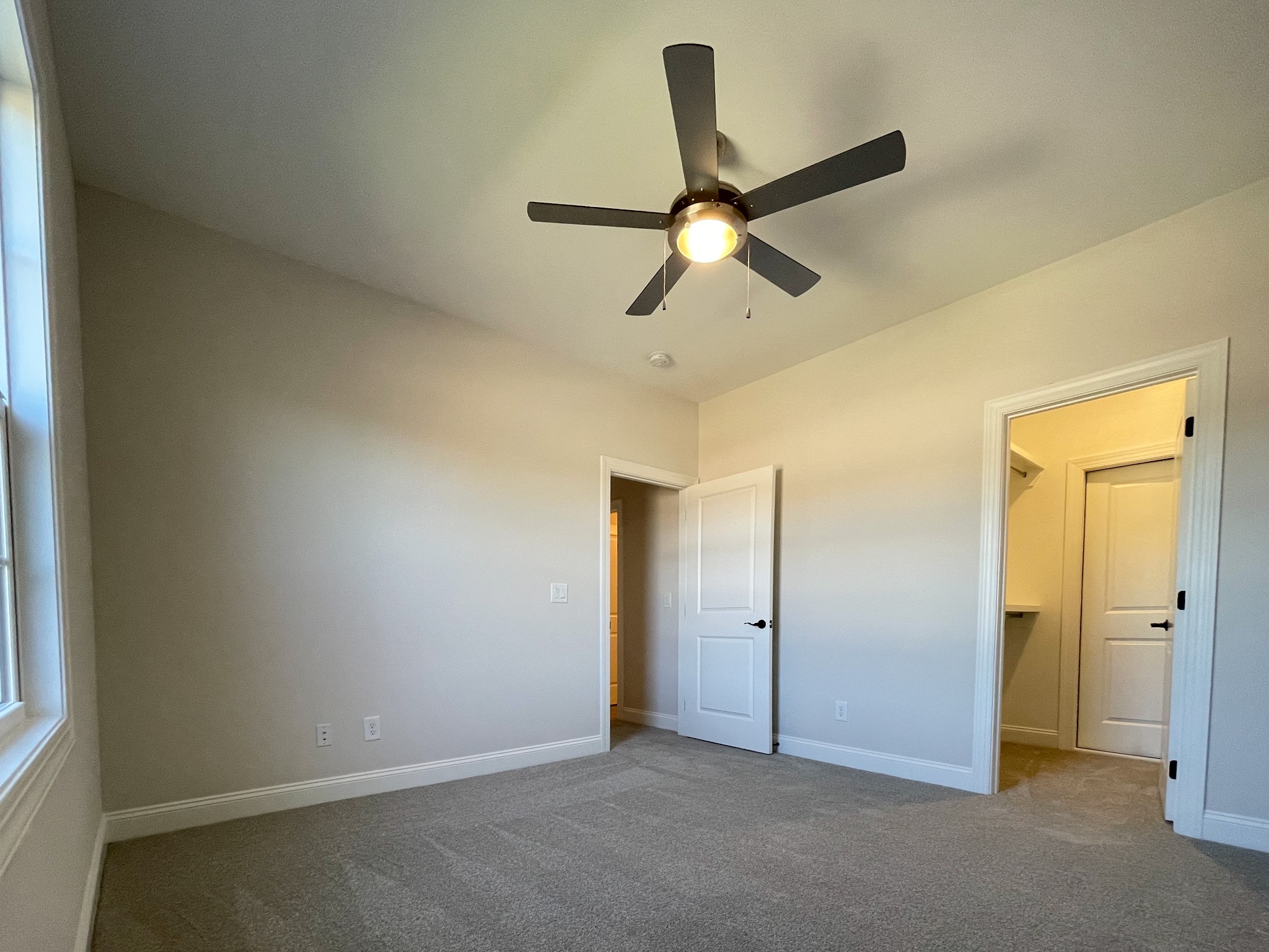 3035 Turnstone Trace Spring Hill, TN 37174 - Photo 31 of 41 an empty room with closet and a ceiling fan