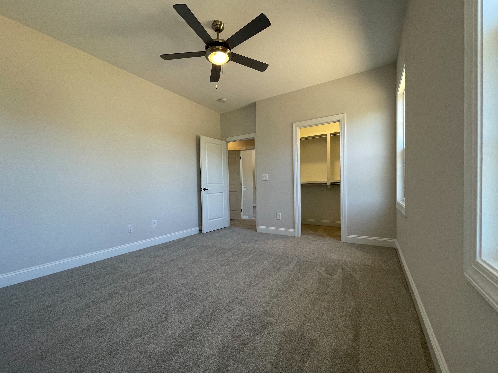 3035 Turnstone Trace Spring Hill, TN 37174 - Photo 34 of 41 an empty room with closet and a ceiling fan