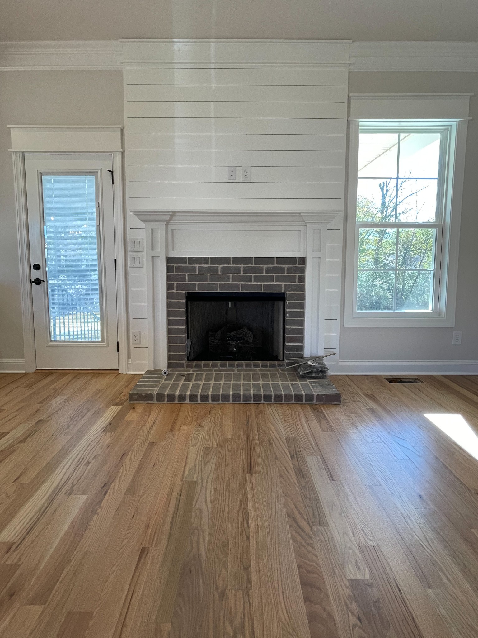 3035 Turnstone Trace Spring Hill, TN 37174 - Photo 7 of 41 an empty room with wooden floor fireplace and windows