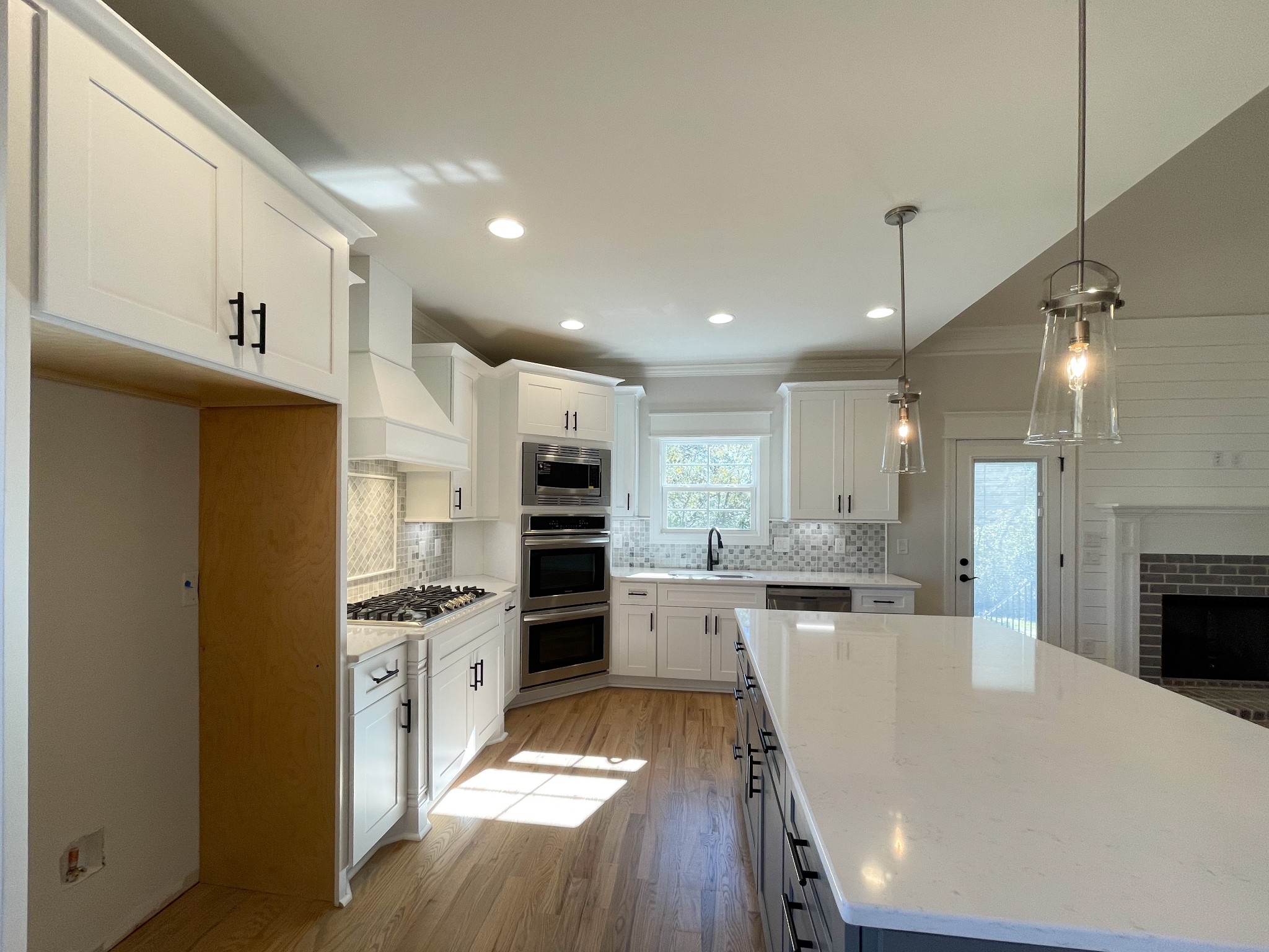 3035 Turnstone Trace Spring Hill, TN 37174 - Photo 8 of 41 a kitchen with stainless steel appliances a stove refrigerator sink and cabinets