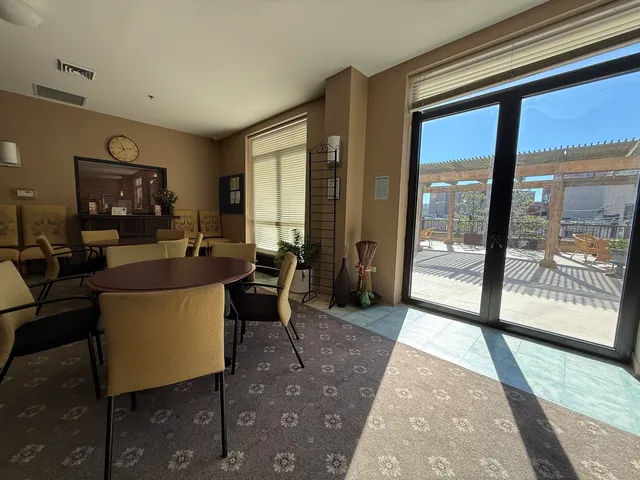 a kitchen with granite countertop a refrigerator stove top oven and sink