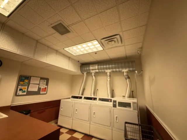 a view of a storage & utility room with a washing machine