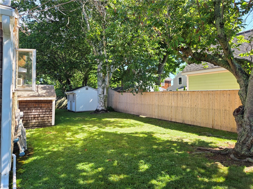 23 Butler Street Newport, RI 02840 - Photo 15 of 18 Shady back yard with privacy fence