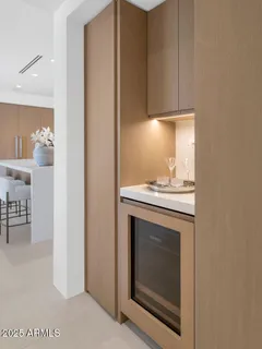 a stove top oven sitting inside of a kitchen