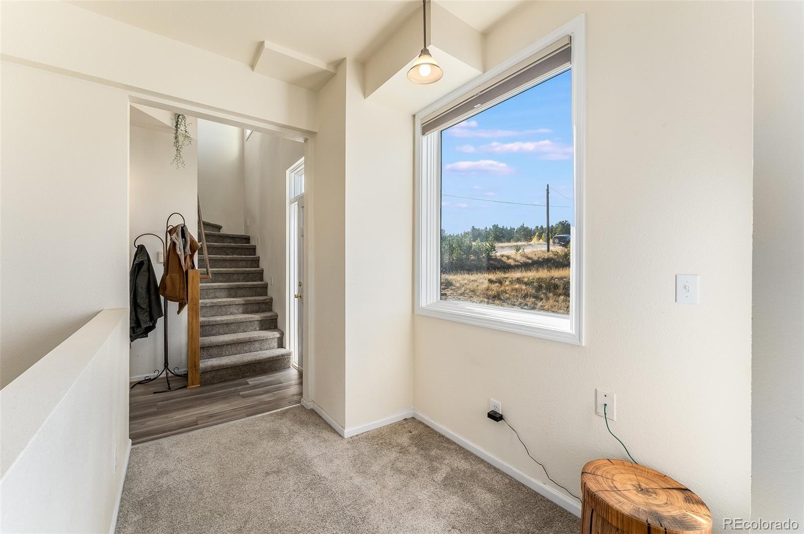 285 Appleby Street Bailey, CO 80421 - Photo 13 of 35 a view of room with stairs and a window