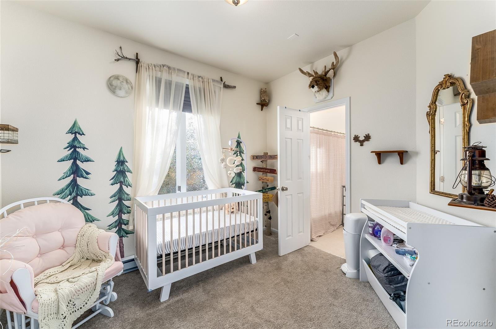 285 Appleby Street Bailey, CO 80421 - Photo 17 of 35 a bedroom with a bed and a window