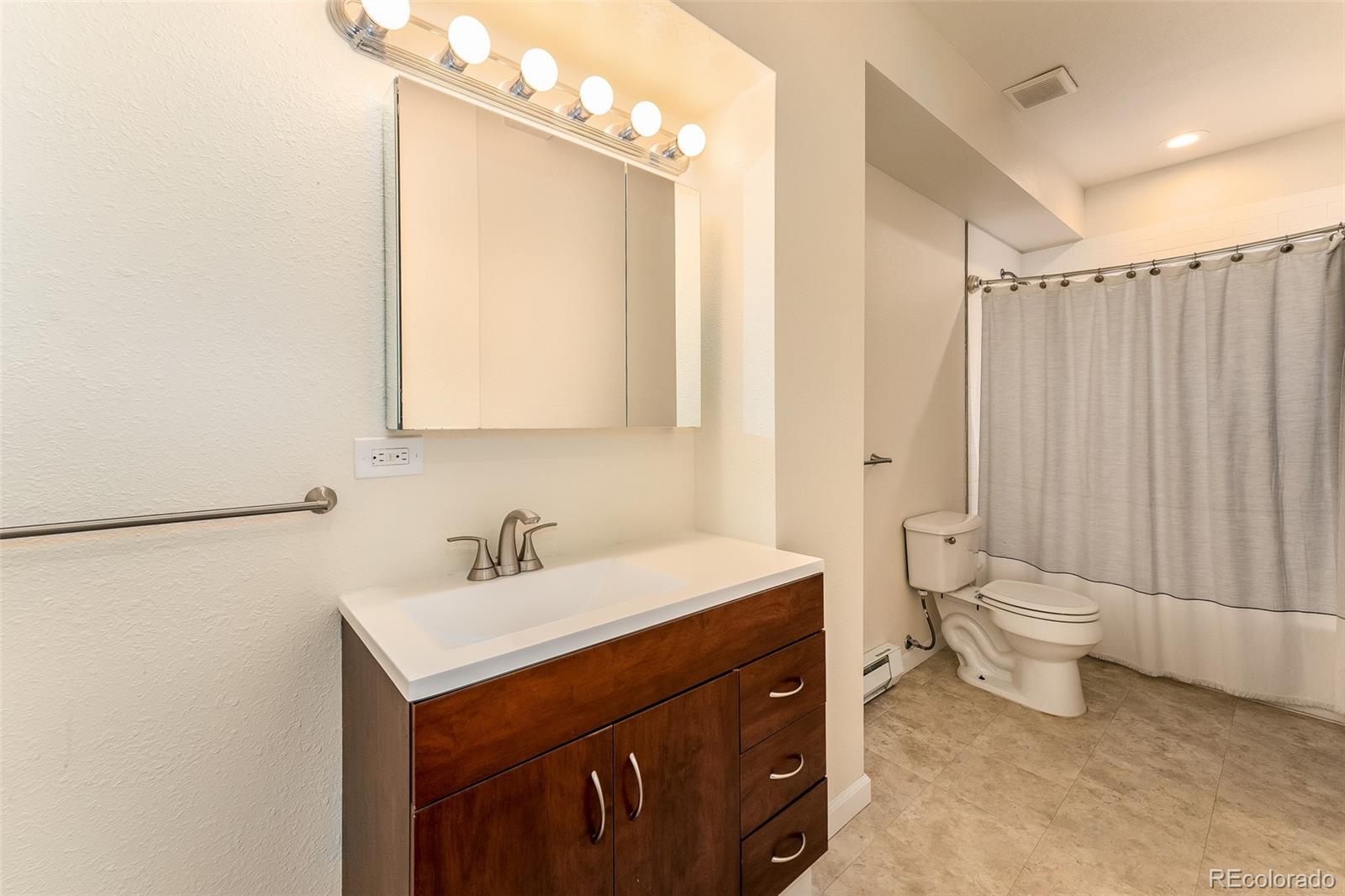 285 Appleby Street Bailey, CO 80421 - Photo 19 of 35 a bathroom with a sink a toilet and shower