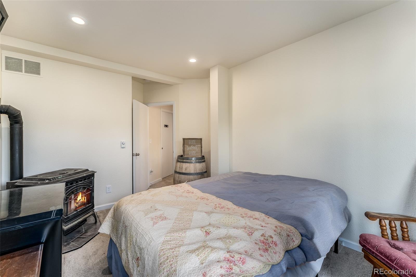 285 Appleby Street Bailey, CO 80421 - Photo 20 of 35 a bedroom with a bed and a tv