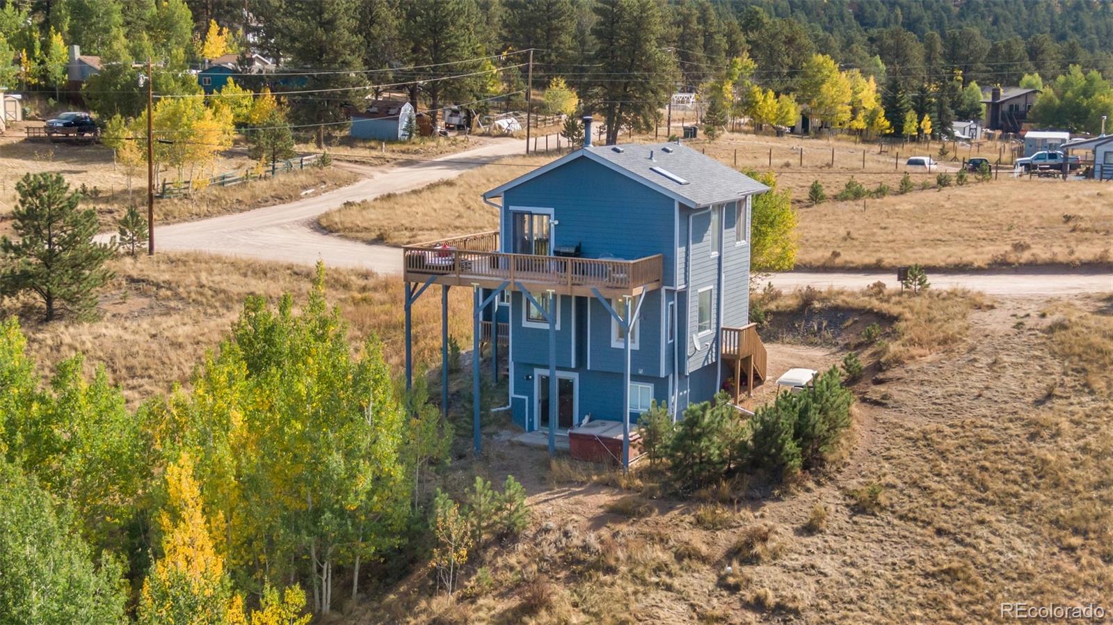 285 Appleby Street Bailey, CO 80421 - Photo 26 of 35 a view of a house with a yard