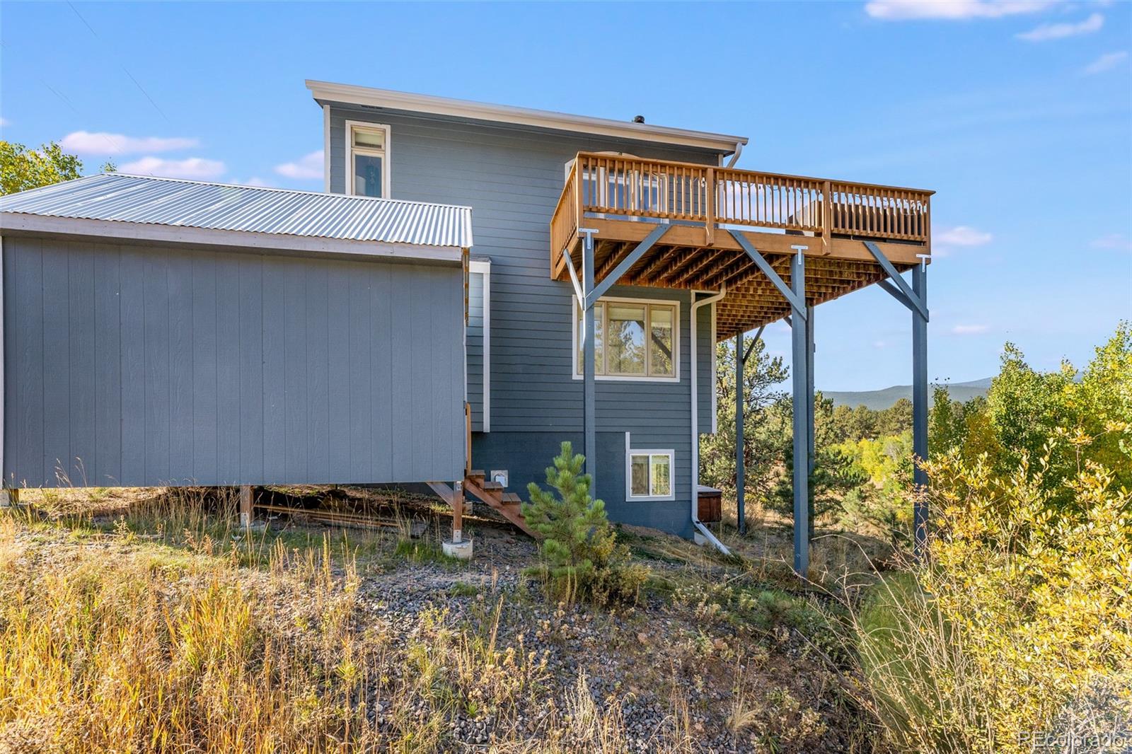 285 Appleby Street Bailey, CO 80421 - Photo 29 of 35 a view of a house with a yard