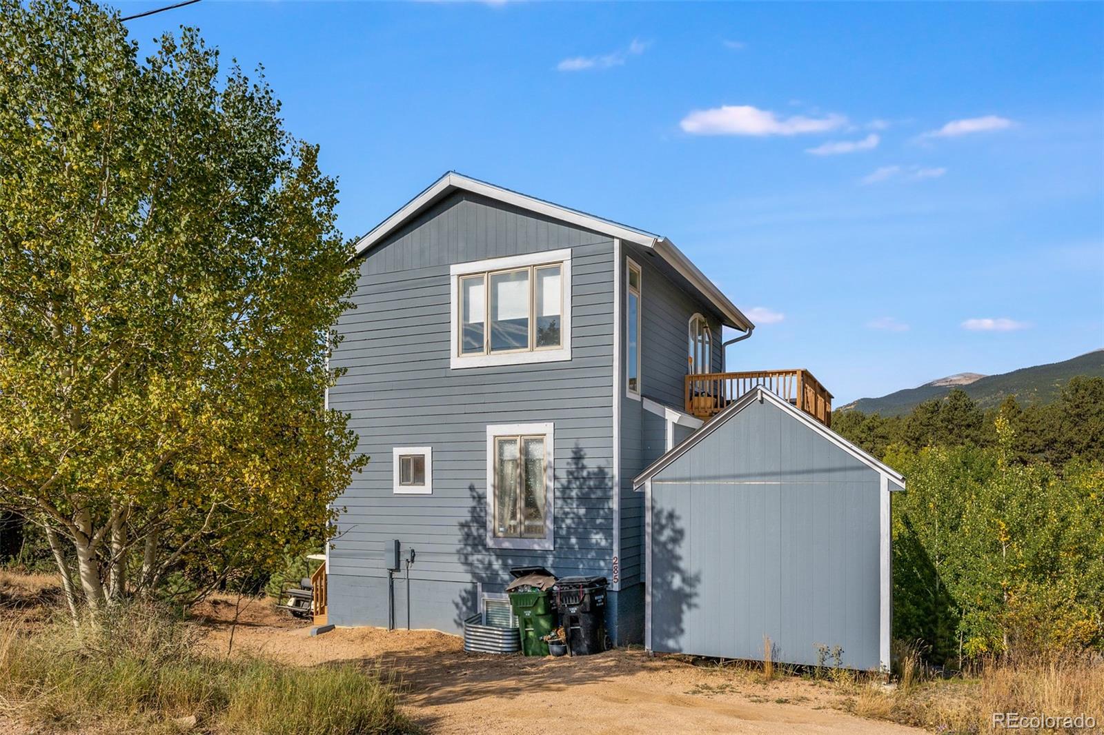 285 Appleby Street Bailey, CO 80421 - Photo 31 of 35 a view of a house with a yard
