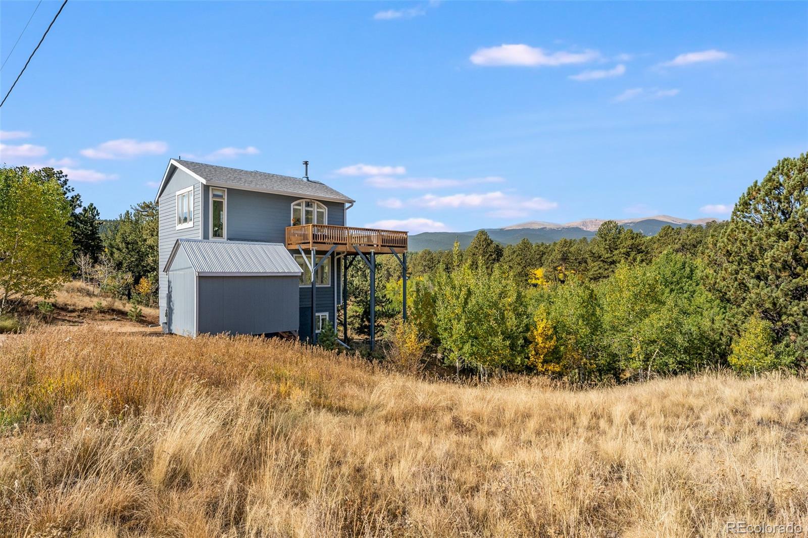 285 Appleby Street Bailey, CO 80421 - Photo 32 of 35 a view of a house with a yard