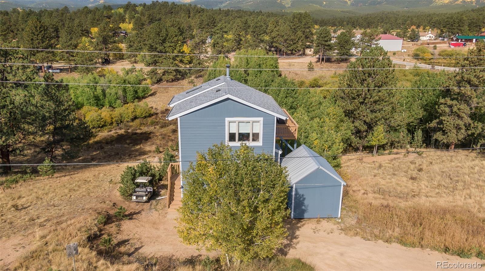 285 Appleby Street Bailey, CO 80421 - Photo 34 of 35 a view of a house with a yard