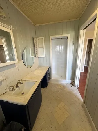 a bathroom with a sink a mirror and a bathtub