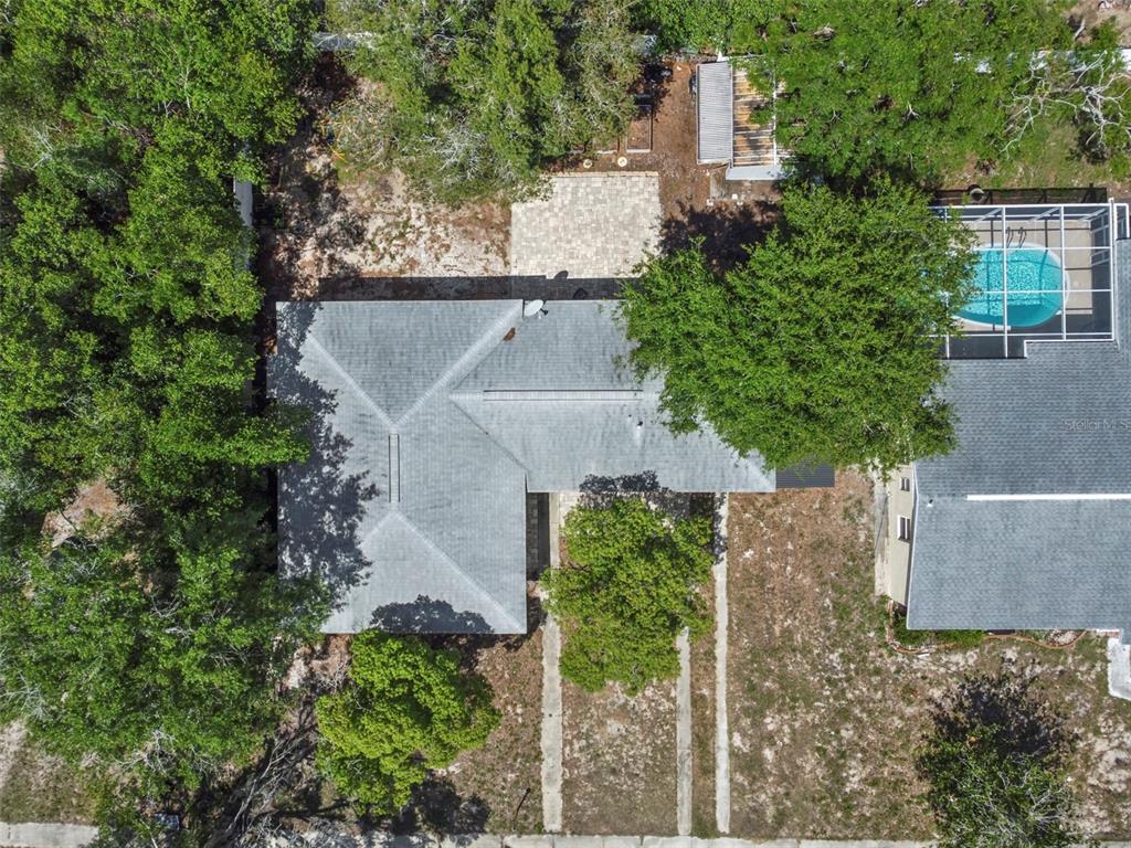 6221 Dalton Street Spring Hill, FL 34606 - Photo 35 of 40 an aerial view of a house with a yard and large tree