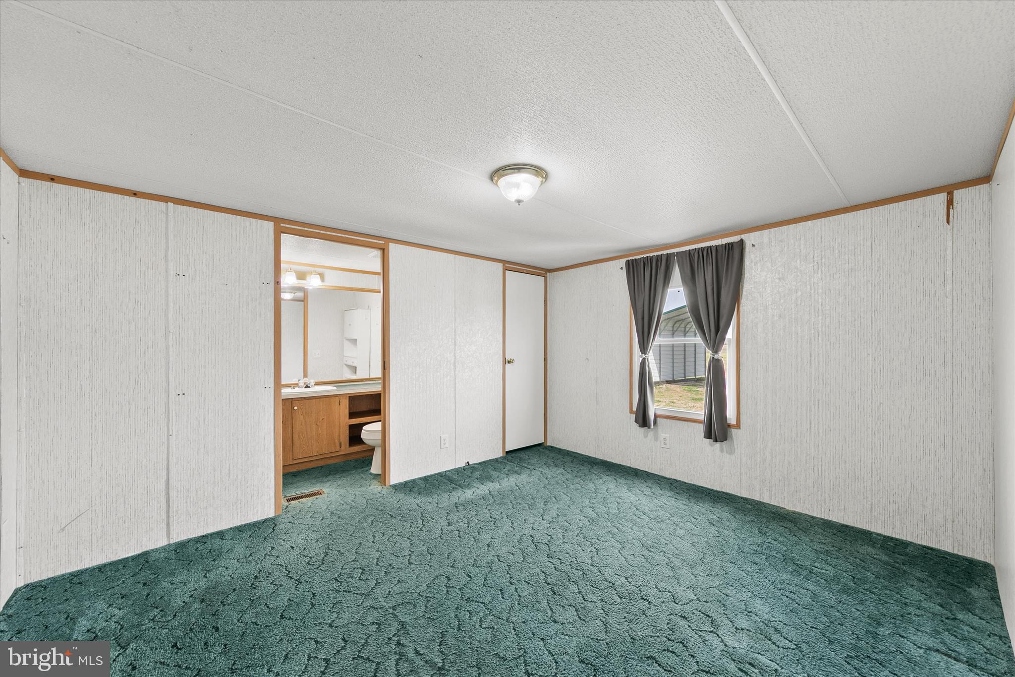 36999 Hudson Road Selbyville, DE 19975 - Photo 13 of 28 a view of an empty room with closet and a window