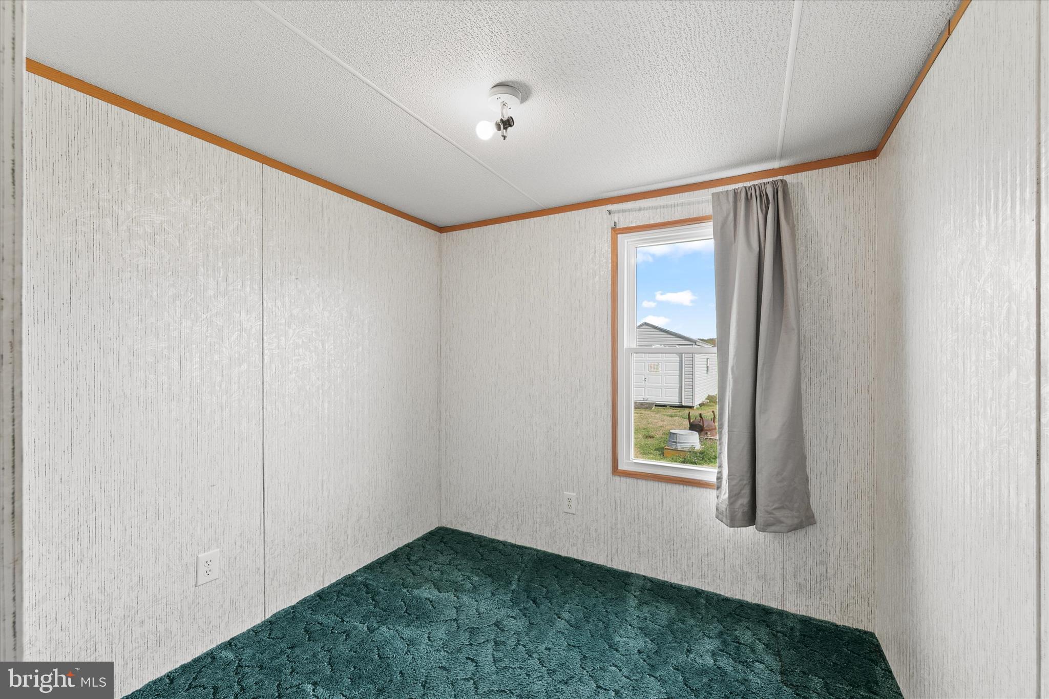 36999 Hudson Road Selbyville, DE 19975 - Photo 18 of 28 a view of an empty room with window