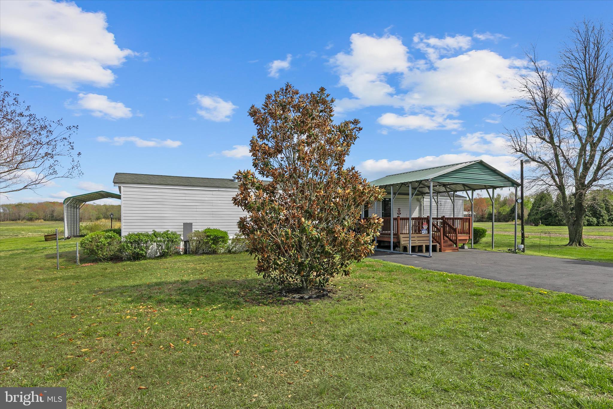 36999 Hudson Road Selbyville, DE 19975 - Photo 2 of 28 a view of a house with a yard and pathway