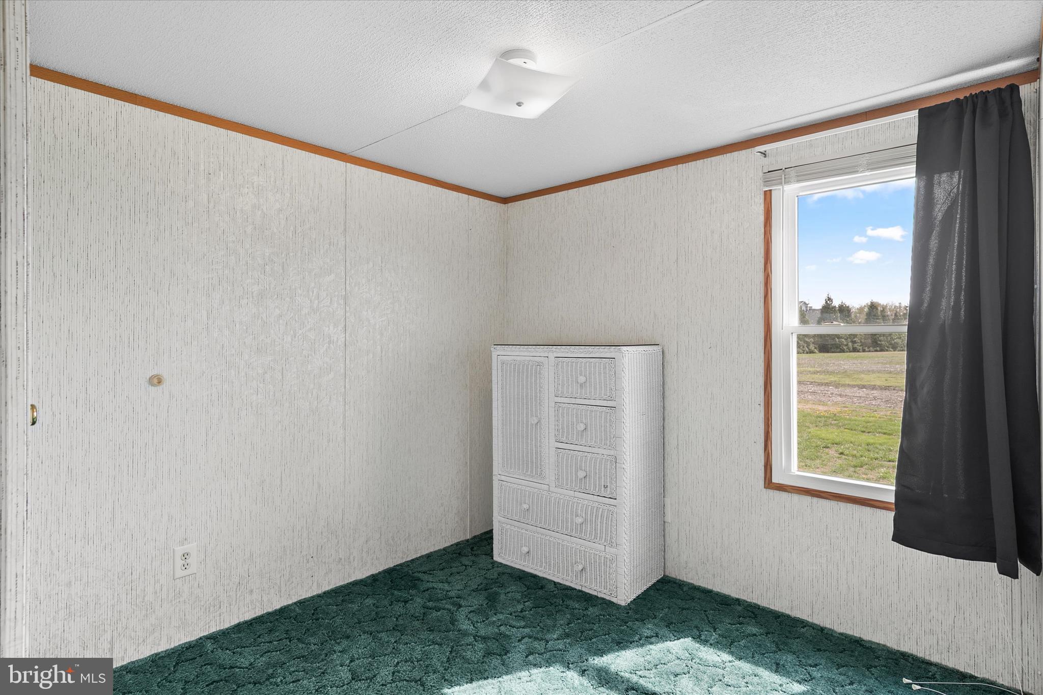 36999 Hudson Road Selbyville, DE 19975 - Photo 21 of 28 a view of an empty room with a window