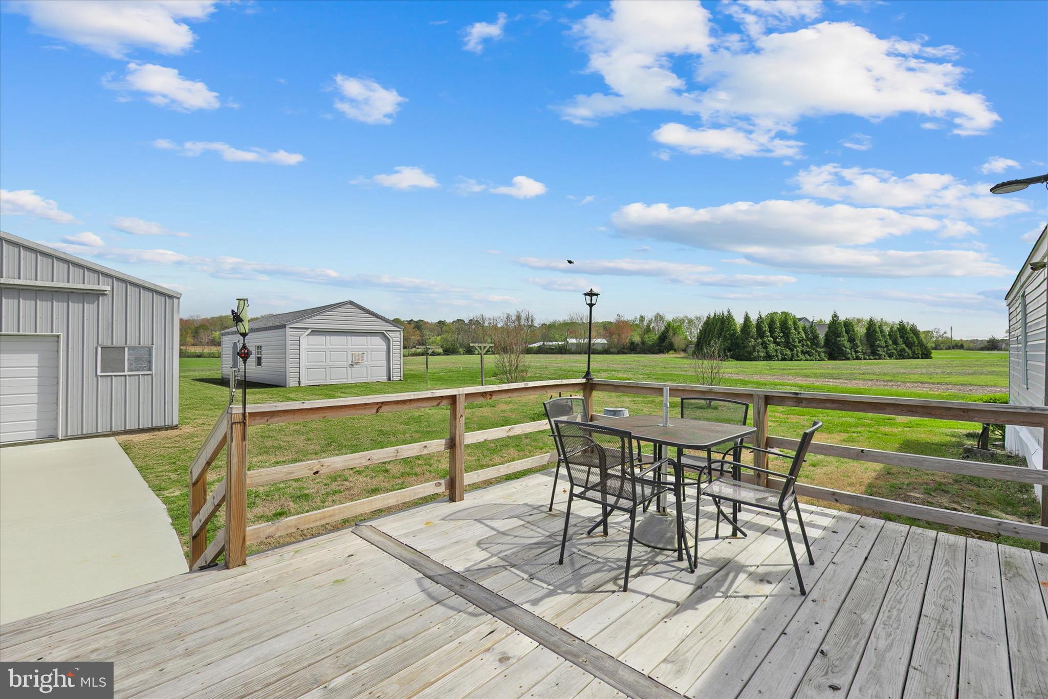 36999 Hudson Road Selbyville, DE 19975 - Photo 25 of 28 a view of a chairs and table on the terrace