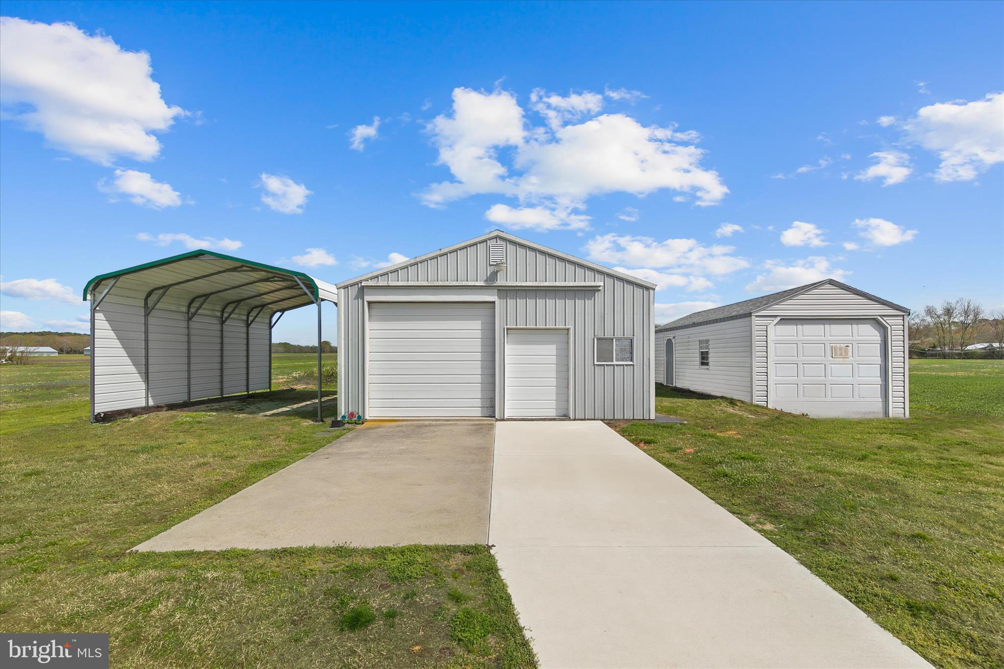 36999 Hudson Road Selbyville, DE 19975 - Photo 26 of 28 a front view of a house with garden