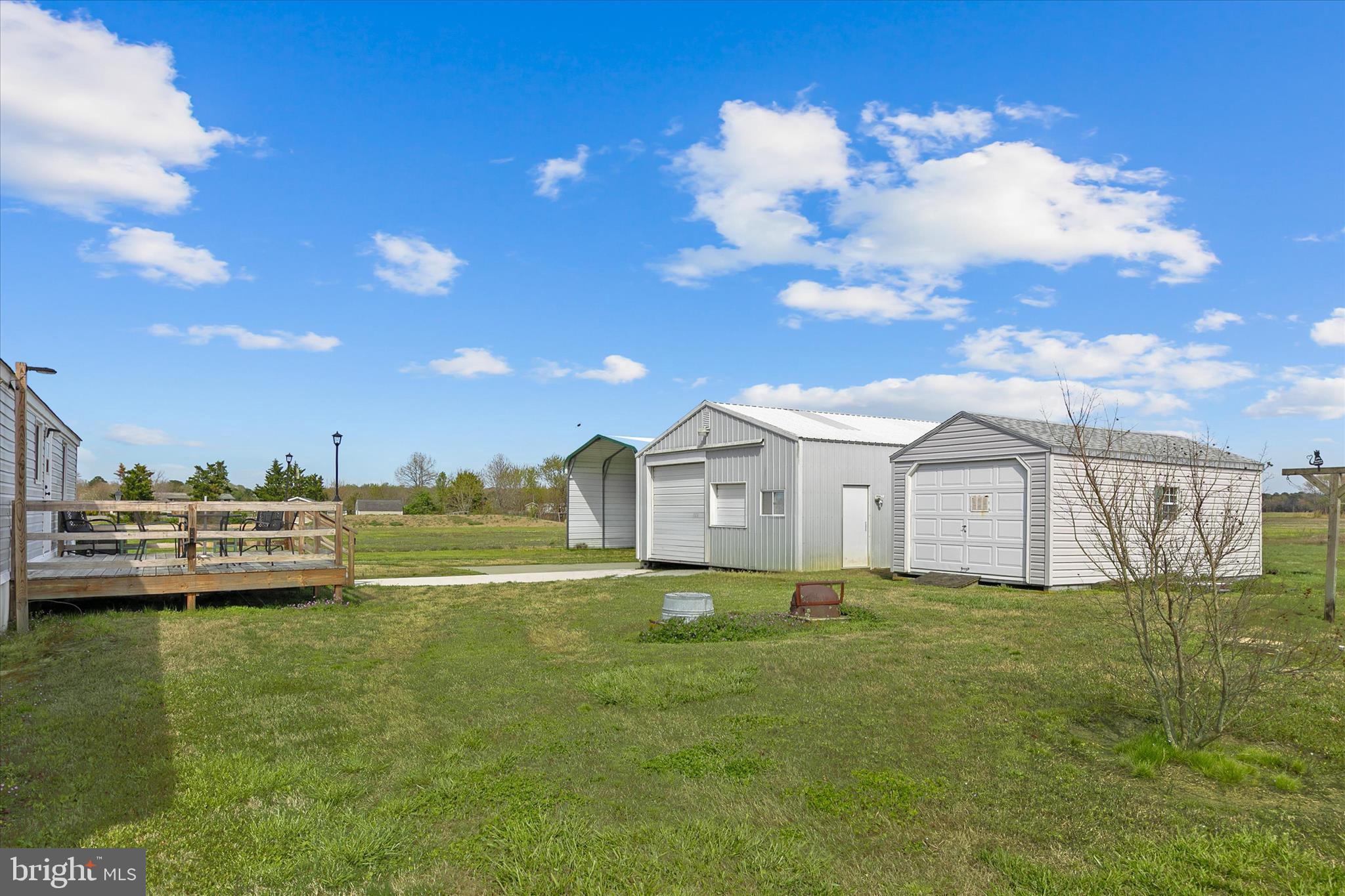 36999 Hudson Road Selbyville, DE 19975 - Photo 27 of 28 a view of a house with a big yard and sitting area