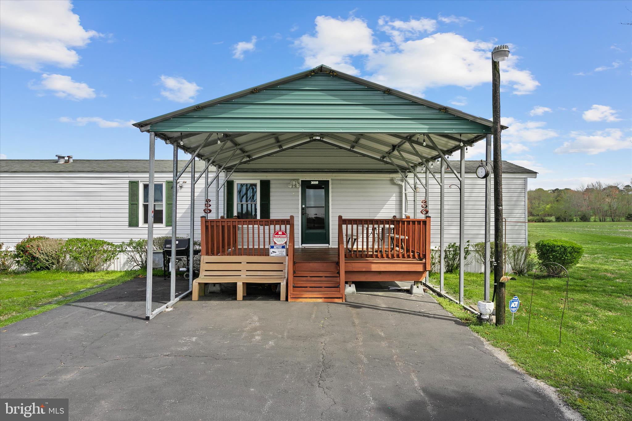 36999 Hudson Road Selbyville, DE 19975 - Photo 4 of 28 a front view of a house with garden