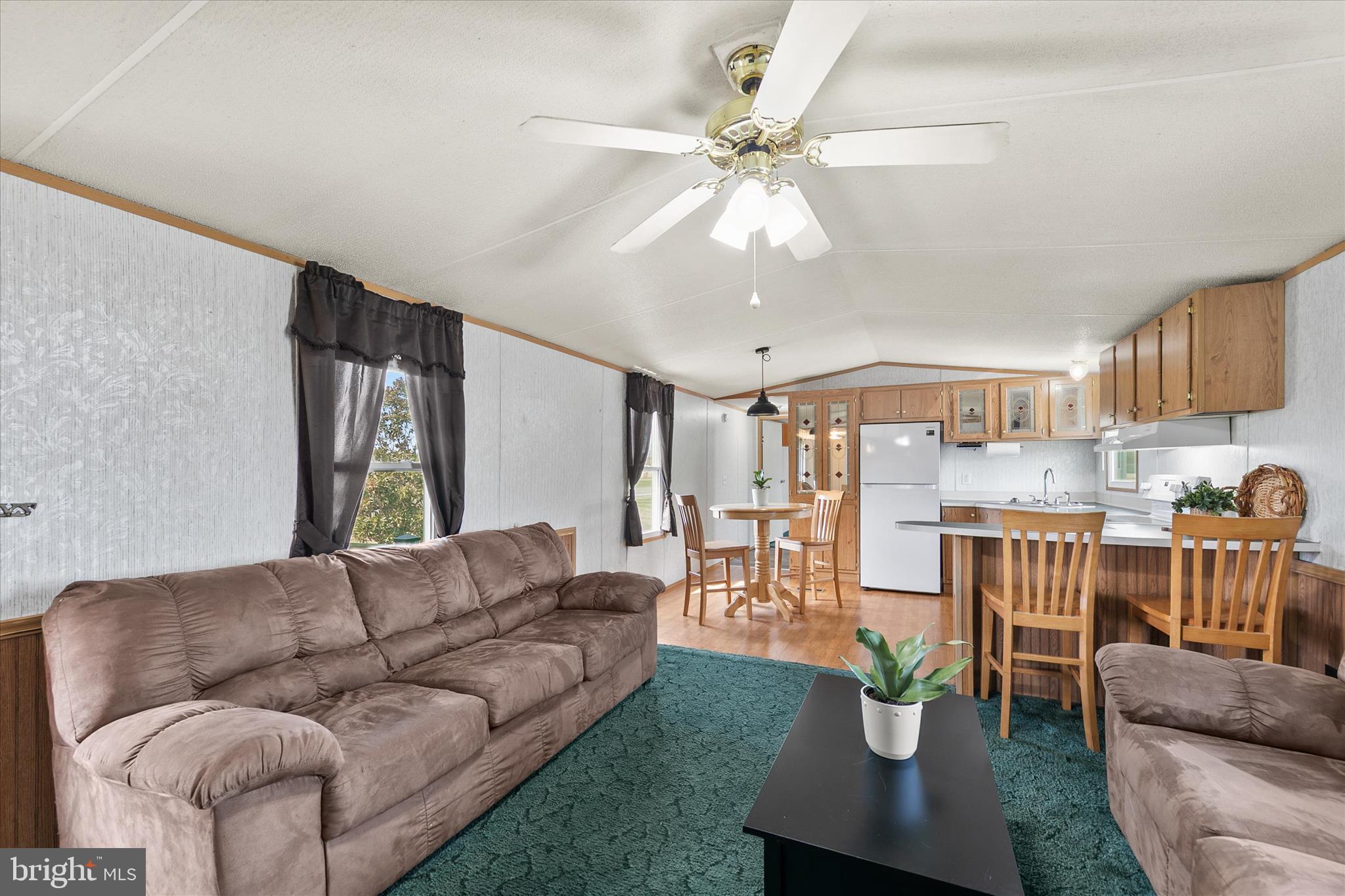 36999 Hudson Road Selbyville, DE 19975 - Photo 8 of 28 a living room with furniture and a large window