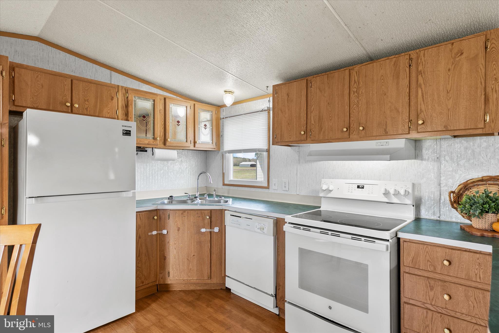 36999 Hudson Road Selbyville, DE 19975 - Photo 10 of 28 a kitchen with a refrigerator sink and cabinets