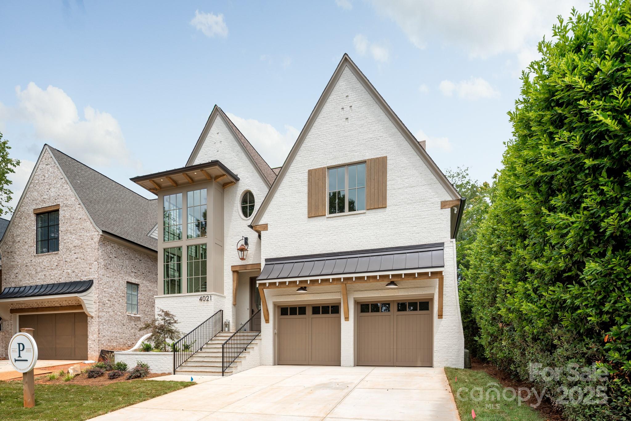 4021 Ridgecrest Avenue Charlotte, NC 28211 - Photo 2 of 47 a view of a house with more windows and plants