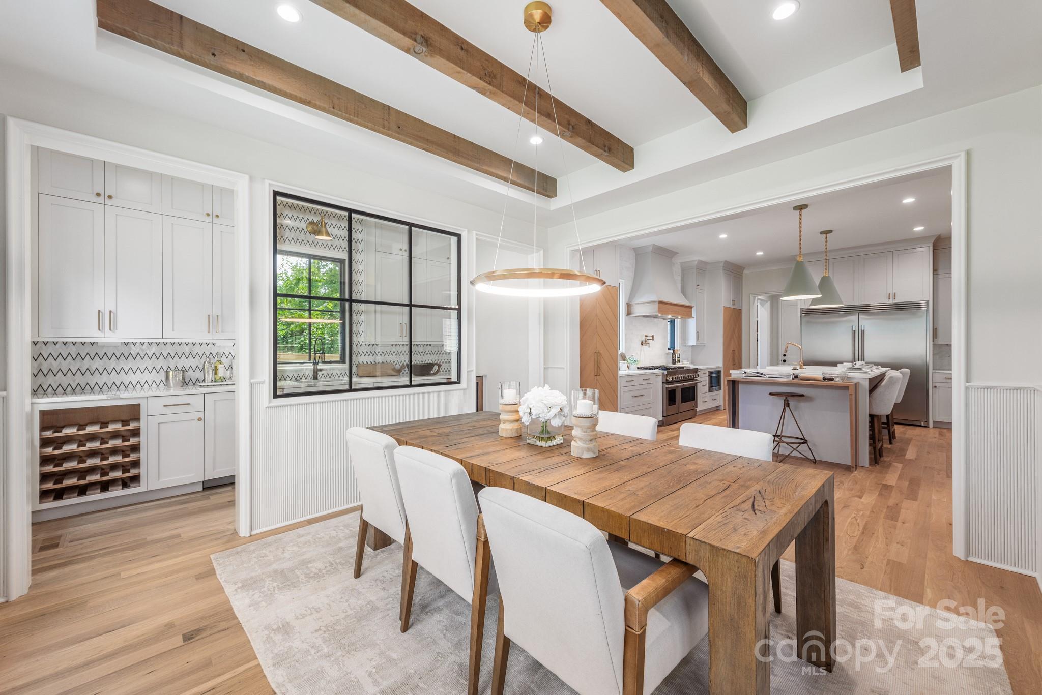 4021 Ridgecrest Avenue Charlotte, NC 28211 - Photo 22 of 47 a dining room with furniture and wooden floor