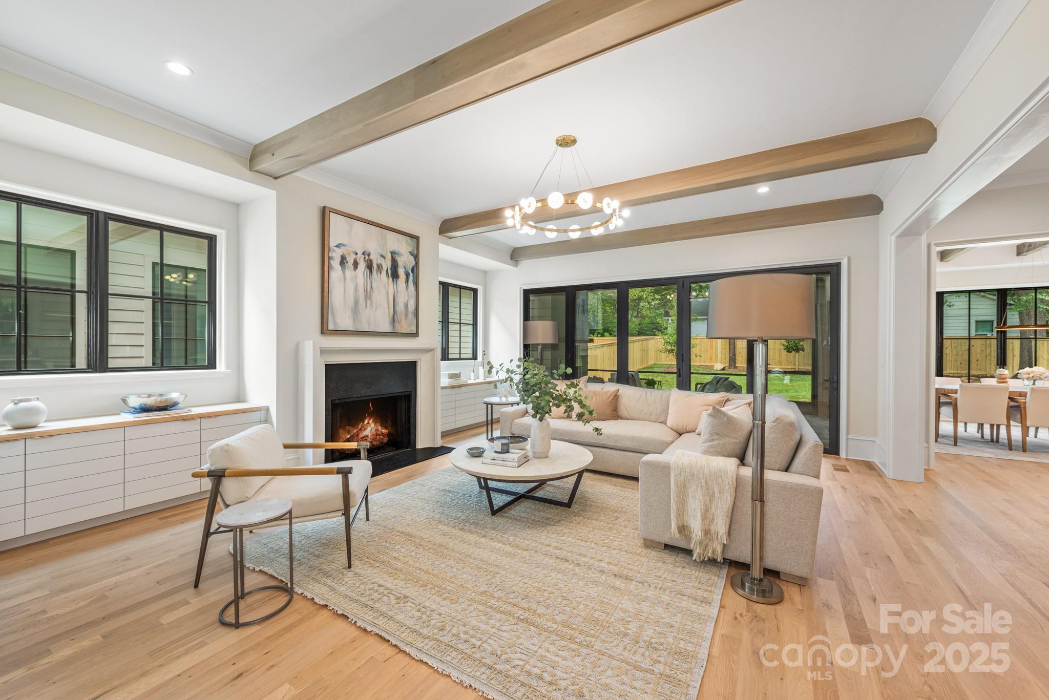 4021 Ridgecrest Avenue Charlotte, NC 28211 - Photo 25 of 47 a living room with furniture and a fireplace