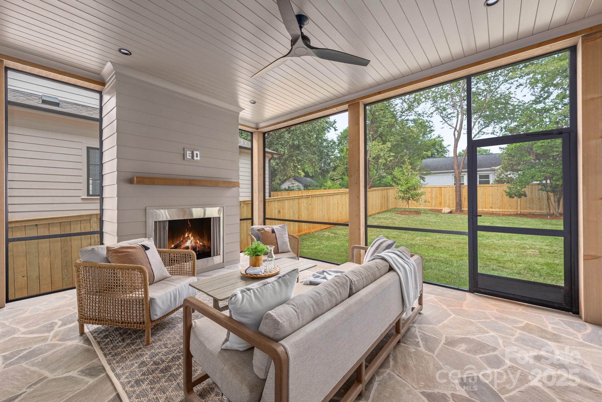 4021 Ridgecrest Avenue Charlotte, NC 28211 - Photo 27 of 47 a living room with furniture and a fireplace
