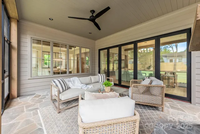 a view of a room with large windows