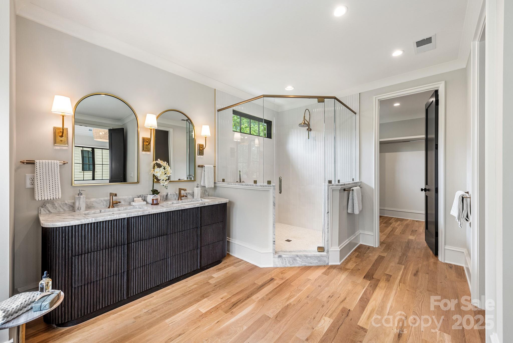 4021 Ridgecrest Avenue Charlotte, NC 28211 - Photo 34 of 47 a bathroom with a double vanity sink mirror and shower