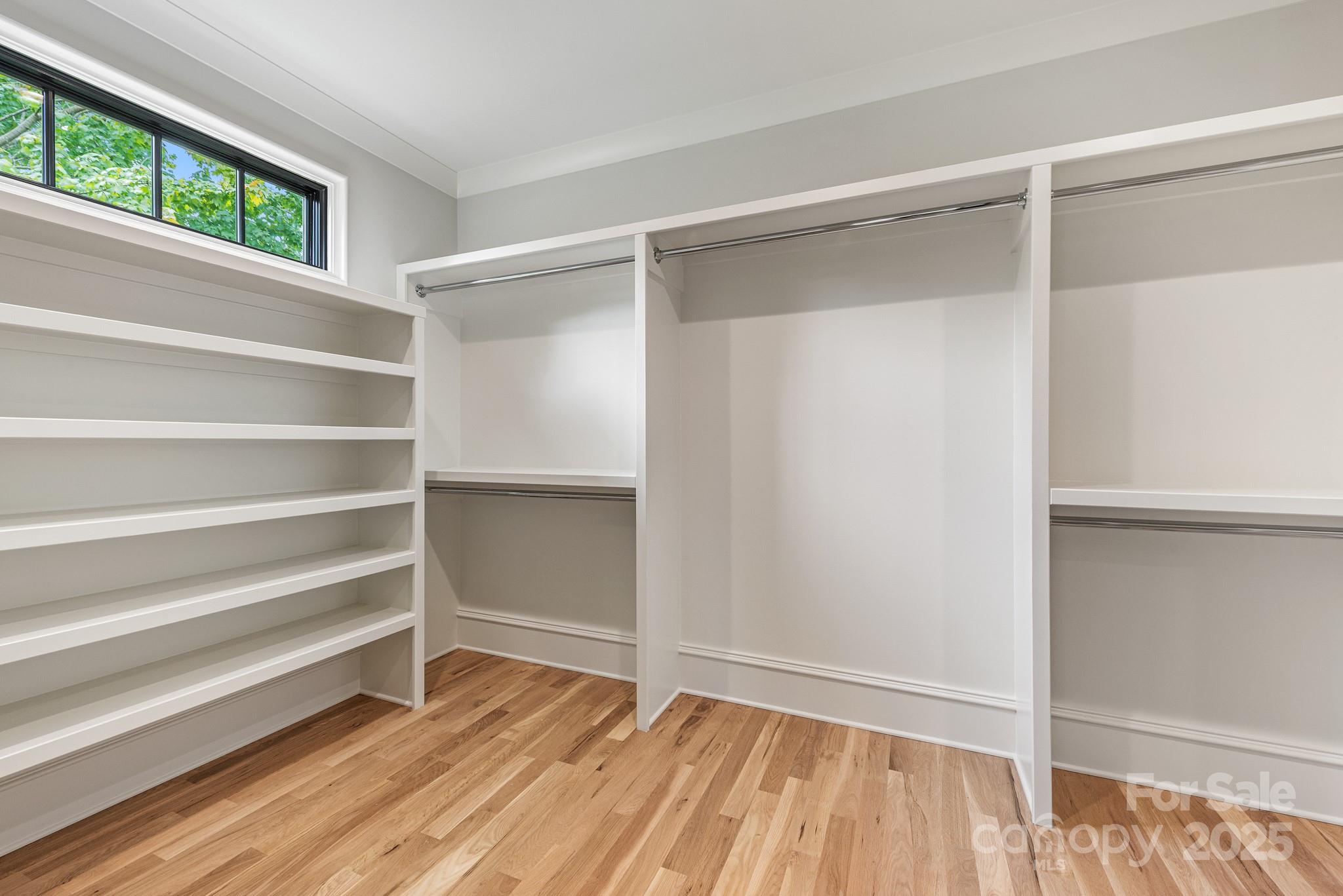 4021 Ridgecrest Avenue Charlotte, NC 28211 - Photo 37 of 47 a view of walk in closet with empty racks
