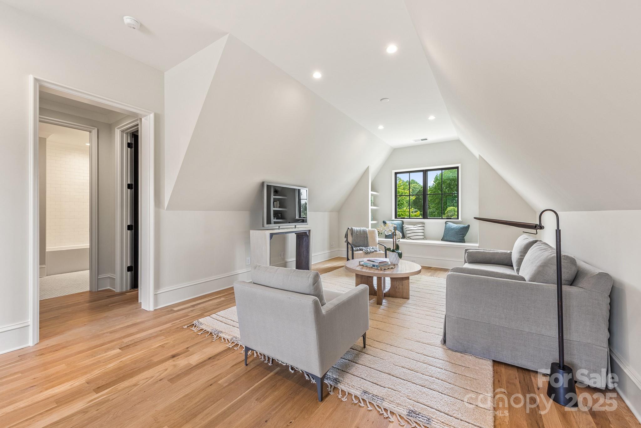 4021 Ridgecrest Avenue Charlotte, NC 28211 - Photo 45 of 47 a living room with couches and a coffee table with wooden floor